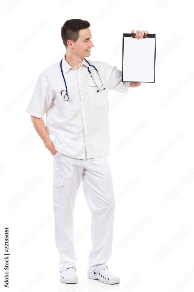 Young male nurse showing a clipboard with copy space Young male nurse showing a clipboard with copy space