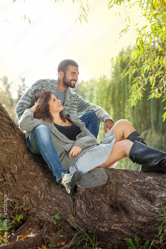 smiling couple in love in autumn in park smiling couple in love in autumn in park