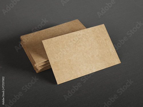 Cardboard business cards on dark background © SFIO CRACHO
