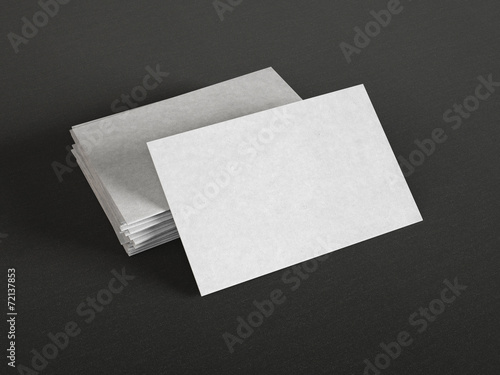 Gray business cards on dark background © SFIO CRACHO