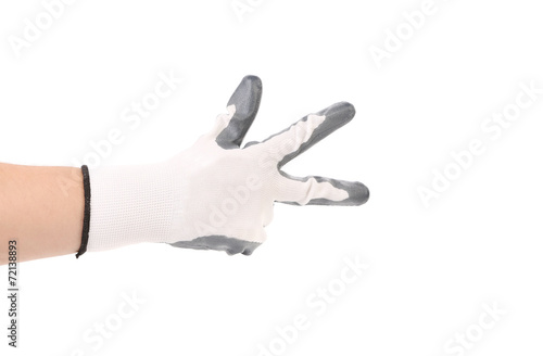 Hand in glove showing three.