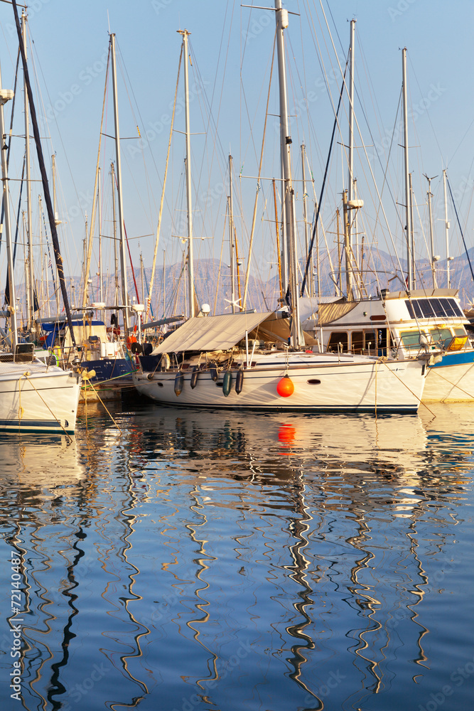 Yachts in Marina of Agios Nikolaos in evening. Crete, Greece - obrazy, fototapety, plakaty 