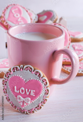 pink cup with milk and homemade cookies
