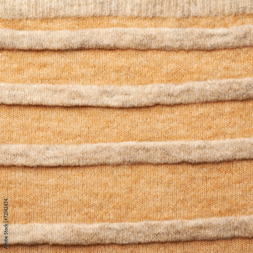 Knitted beige sweater fragment