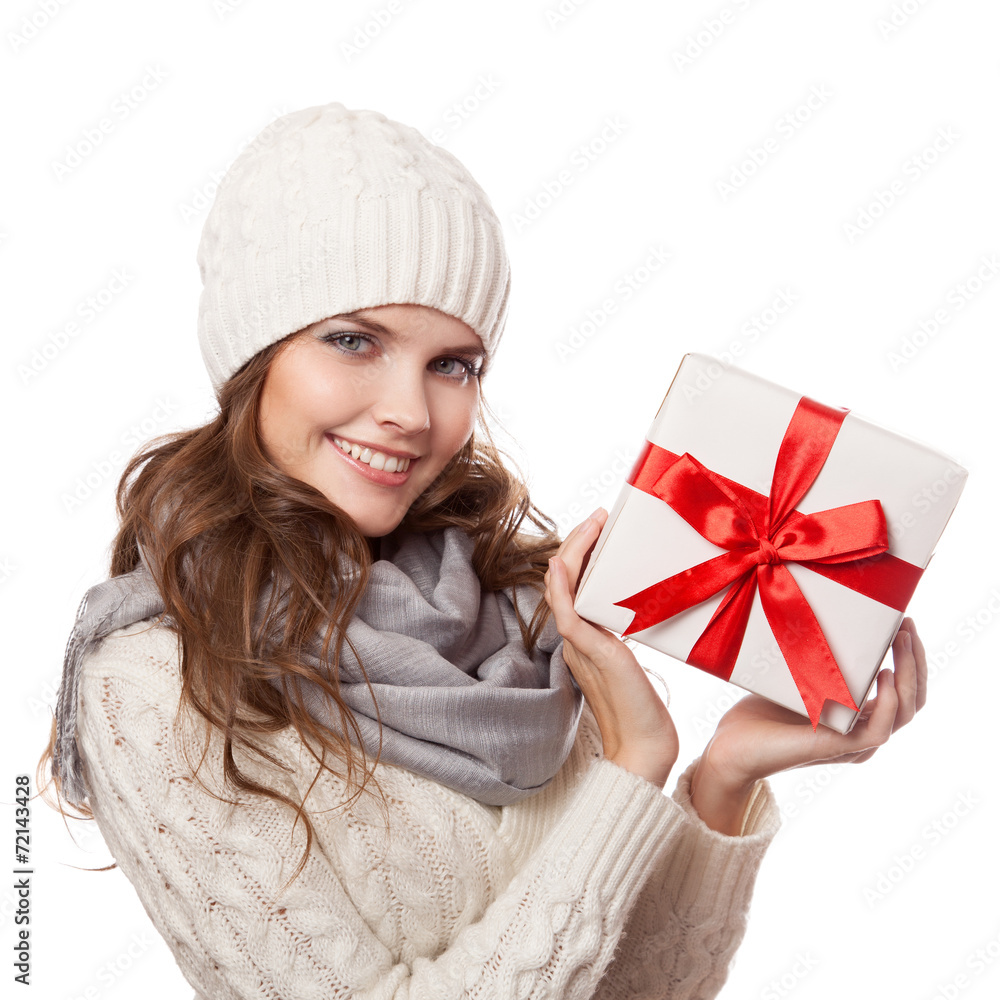 Young happy woman with a gift. Christmas. Isolated. Young happy woman with a gift. Christmas. Isolated.