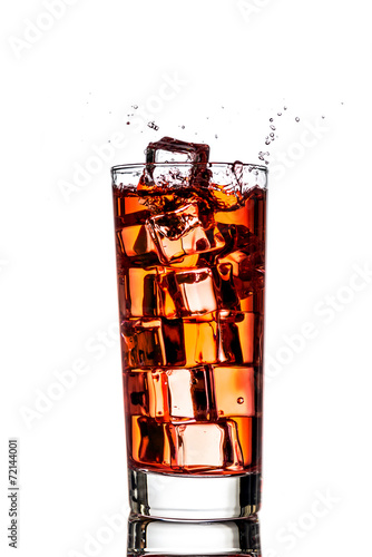 Ice splashing in cup of tea