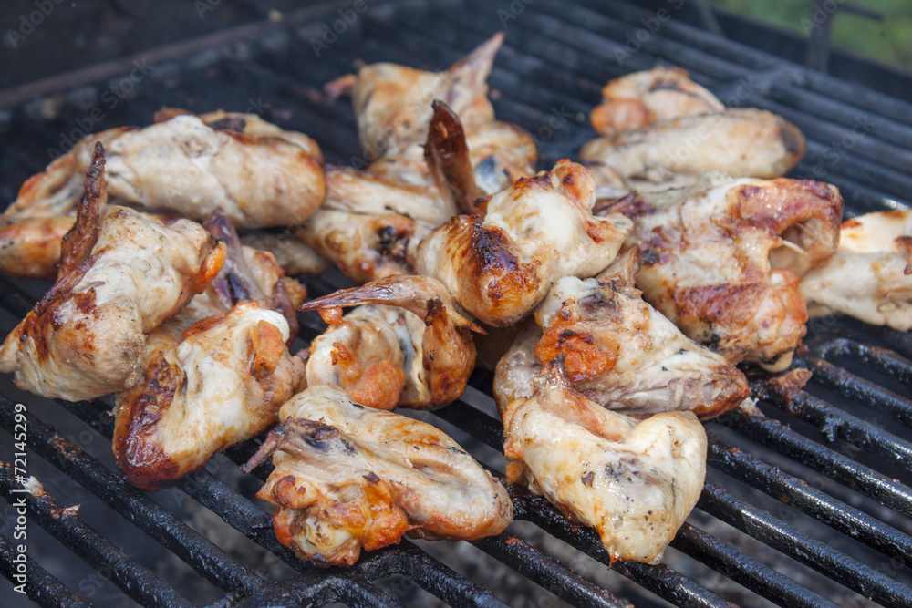 Chicken wings on the grille.