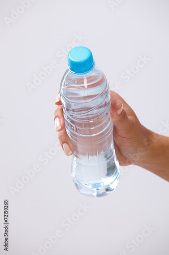 woman hand with bottle of water