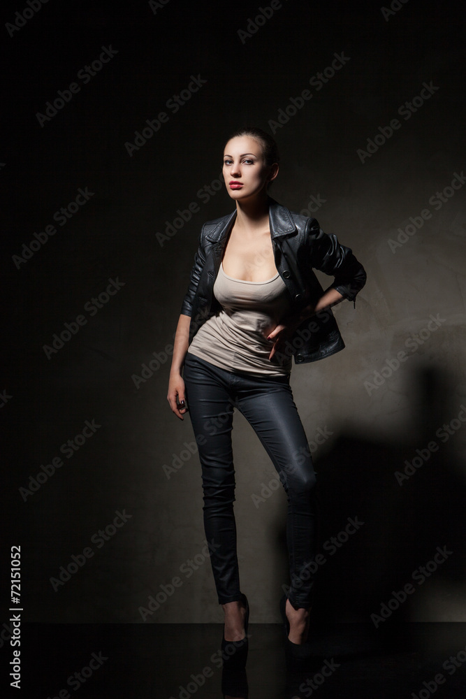attractive woman in black leather jacket and pants attractive woman in black leather jacket and pants