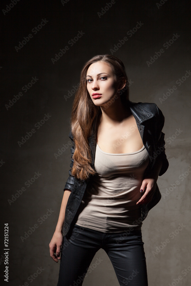 attractive woman in black leather jacket and pants attractive woman in black leather jacket and pants