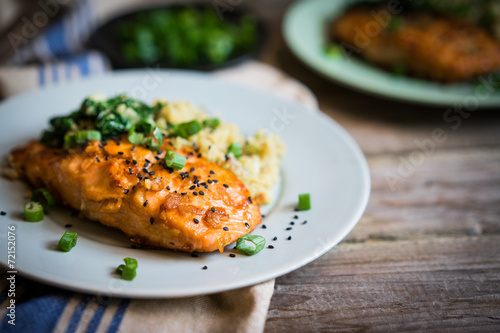 Salmon steak with mashed potatoes and greens