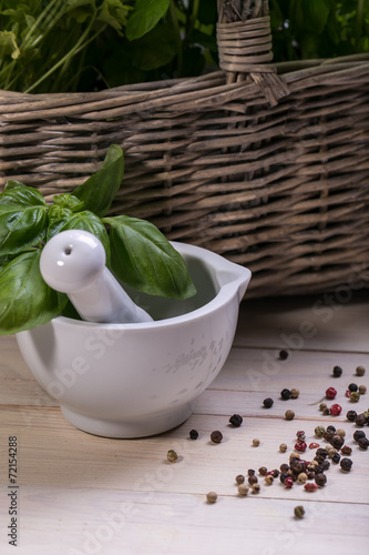 mortar and pestle - herbs and spices, fresh basil and parsley