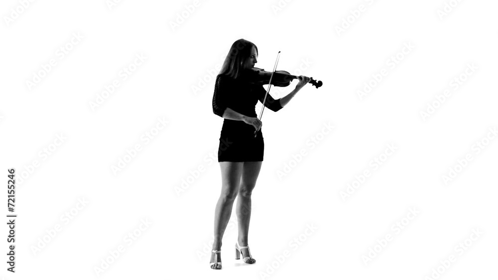 Silhouette of girl in a short black dress playing the violin Silhouette of girl in a short black dress playing the violin