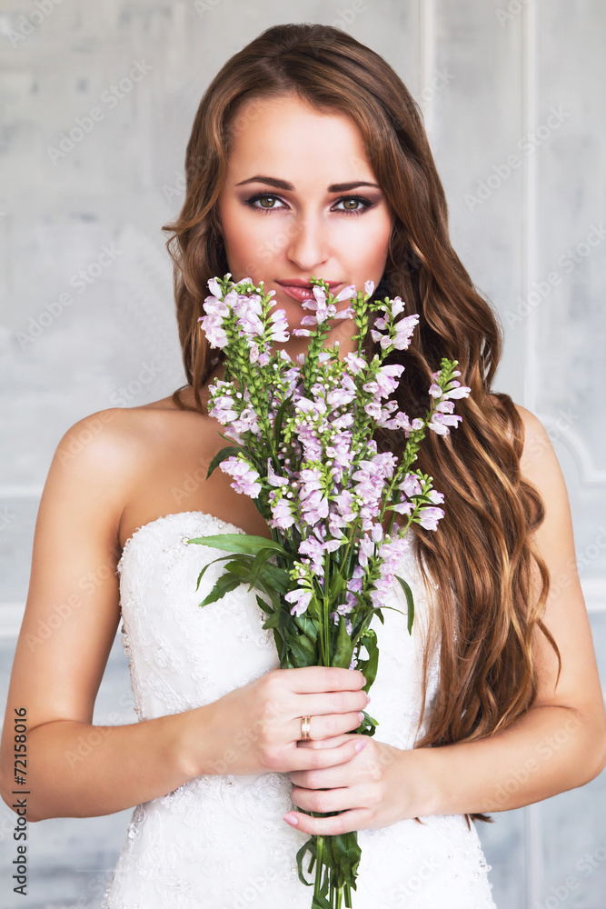 Beautiful girl with a bouquet of flowers