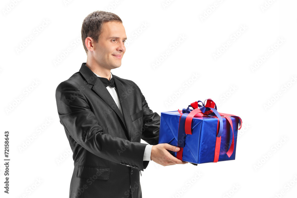 Young guy holding a present isolated on white background Young guy holding a present isolated on white background