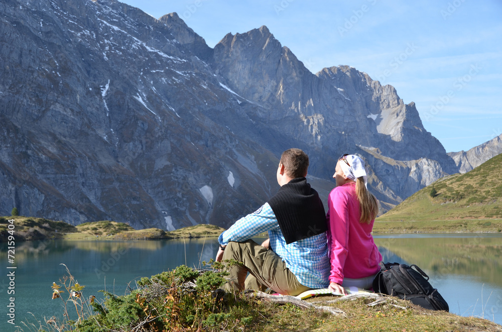 Travelers enjoying alpine view. Switzerland