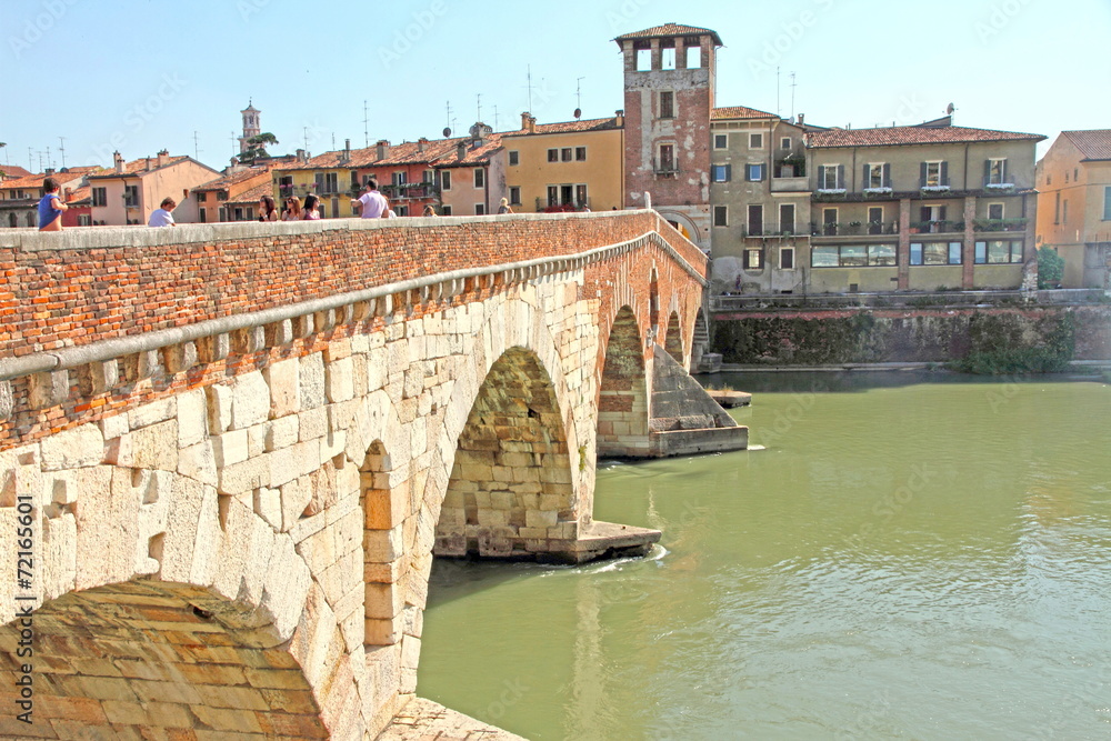 Tourists on Ponte di Pietra, Verona, Veneto, Italy
