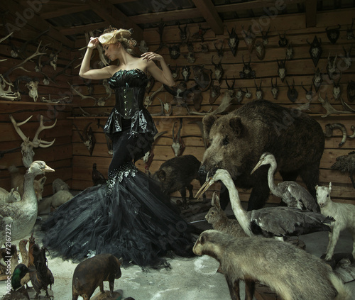 Photography Sensual woman in a locked room full of wild animals