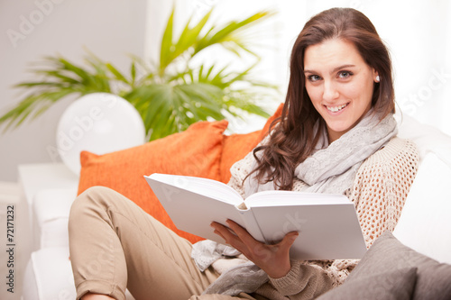 beautiful fascinating woman reading a book