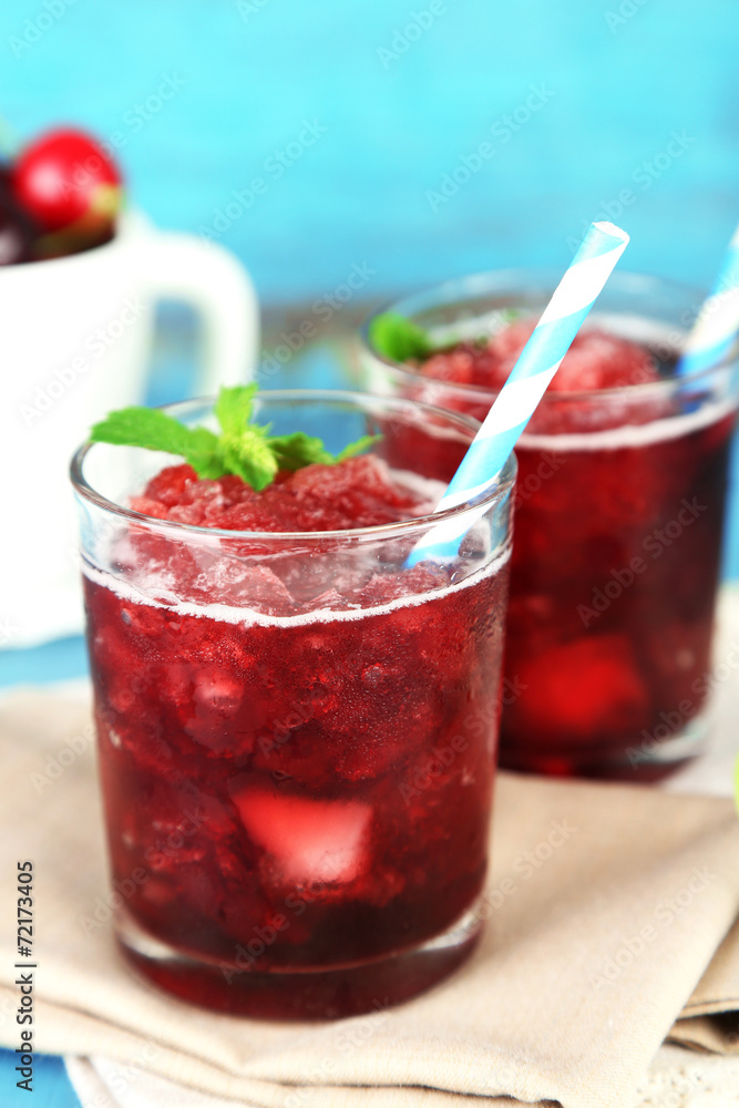 Closeup of cherry granita in glasses, on color wooden Closeup of cherry granita in glasses, on color wooden