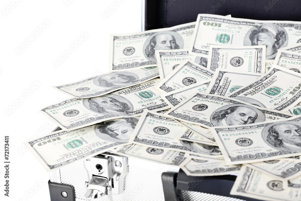 Lot of one hundred dollar bills in suitcase isolated on white Lot of one hundred dollar bills in suitcase isolated on white