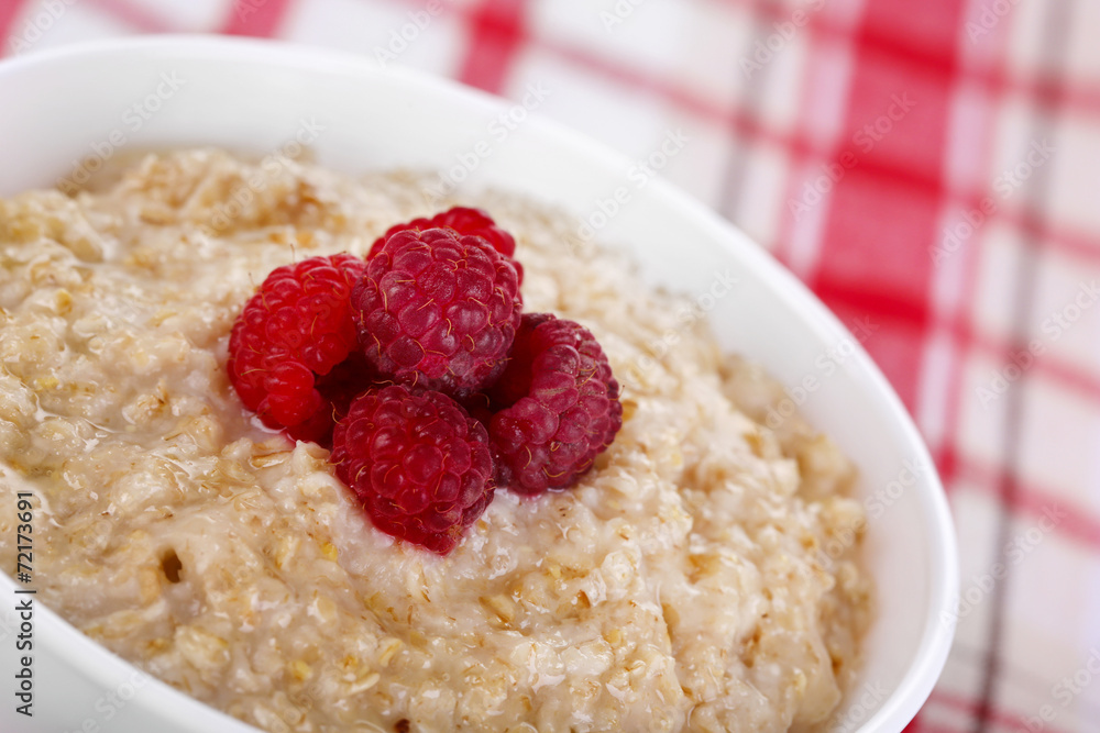 Tasty oatmeal with berries on napkin close-up Tasty oatmeal with berries on napkin close-up