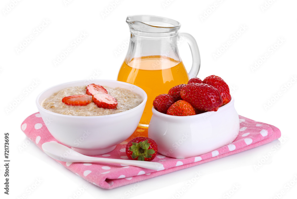 Tasty oatmeal with berries and juice isolated on white Tasty oatmeal with berries and juice isolated on white