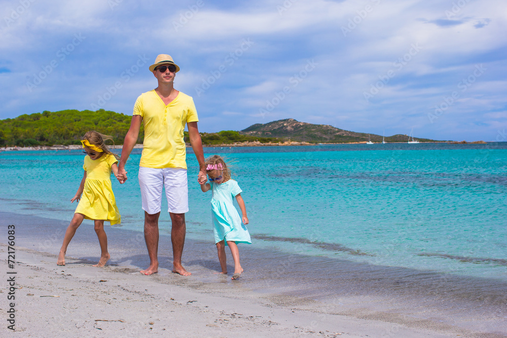 Father and little girls have fun during tropical vacation