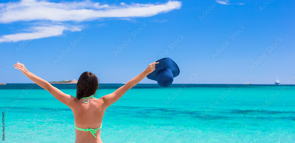 Young beautiful woman relaxing at white sandy tropical beach Young beautiful woman relaxing at white sandy tropical beach