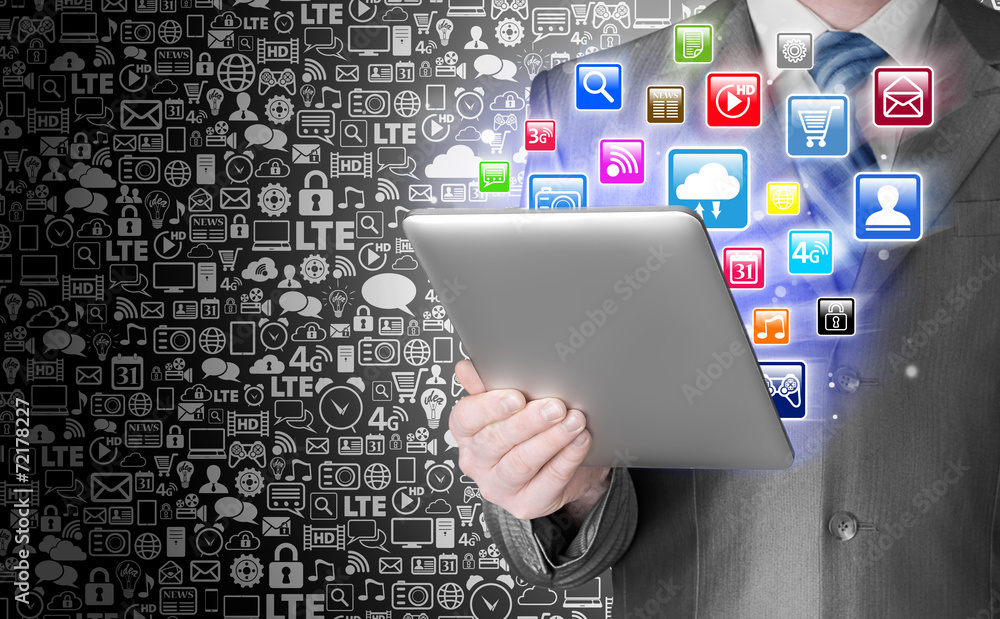 Business man use tablet pc with colorful application icons Business man use tablet pc with colorful application icons