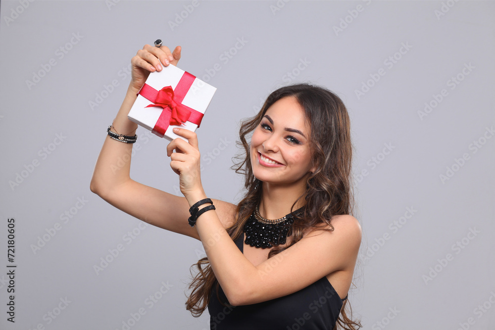 Young woman happy smile hold gift box in hands, isolated over Young woman happy smile hold gift box in hands, isolated over