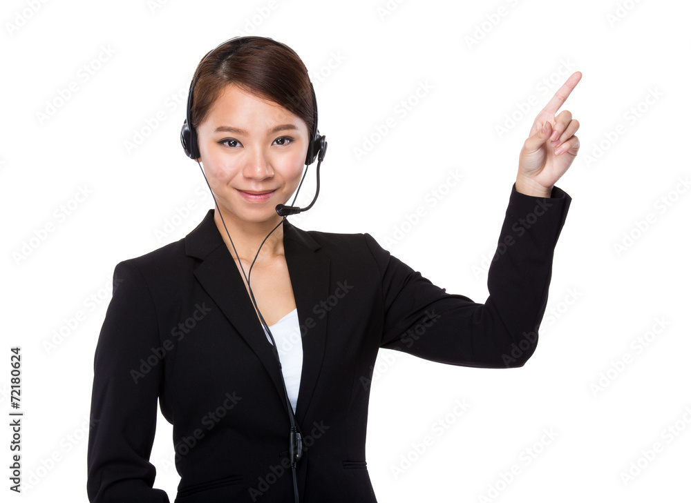 Businesswoman with headset and finger point up Businesswoman with headset and finger point up