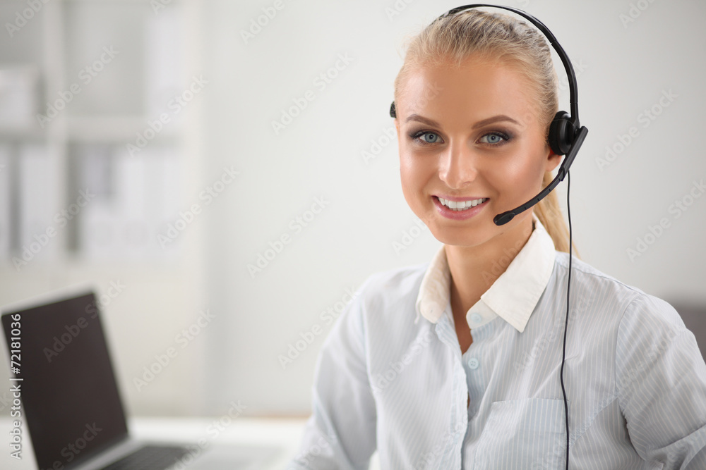 Portrait of beautiful businesswoman working at her desk with Portrait of beautiful businesswoman working at her desk with