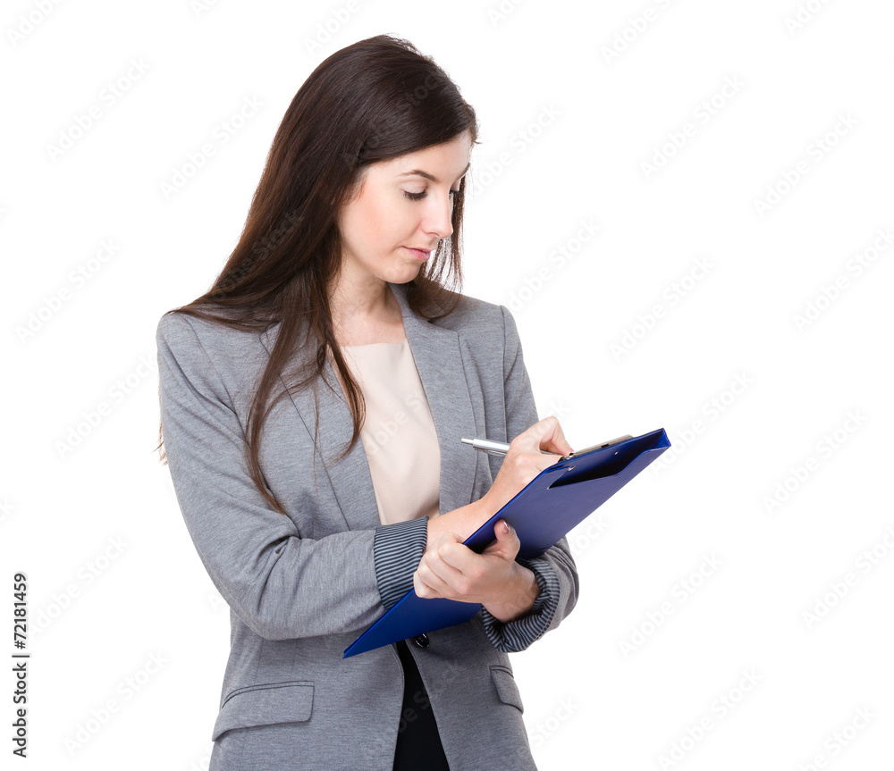 Businesswoman write on clipboard Businesswoman write on clipboard
