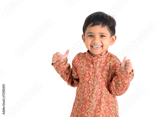 Cute asian boy raised his thumbs up