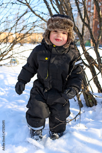 happy 2 year toddler with rosy cheeks in winter