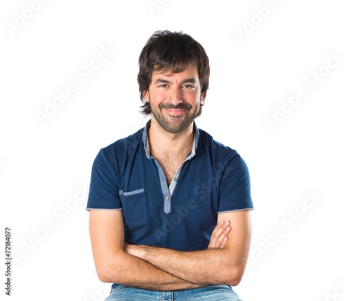 Man with his arms crossed over white background