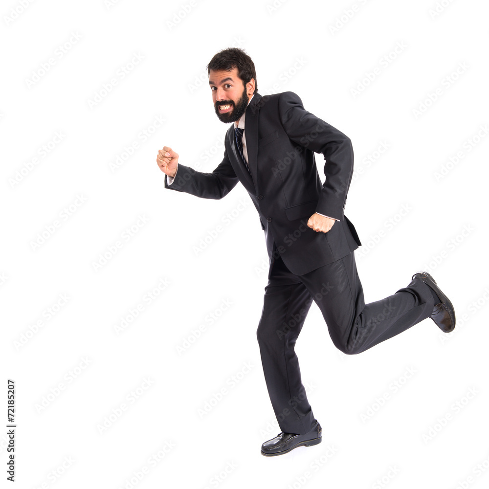 Businessman running fast over white background