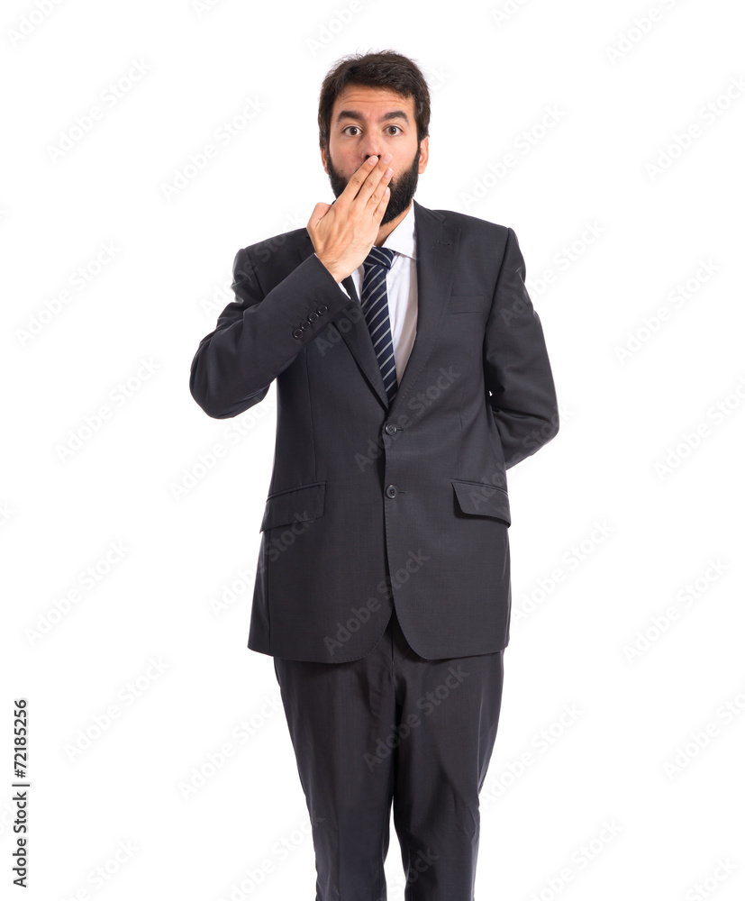 Businessman doing surprise gesture over white background Businessman doing surprise gesture over white background