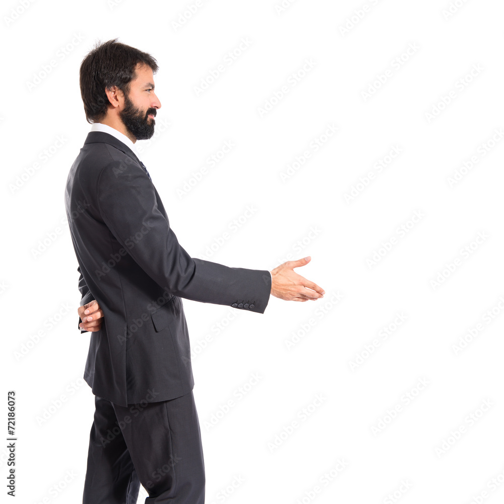 Businessman making a deal over isolated white background Businessman making a deal over isolated white background