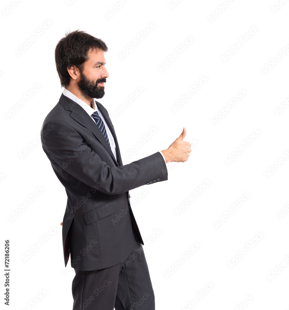 Businessman with thumb up over white background Businessman with thumb up over white background