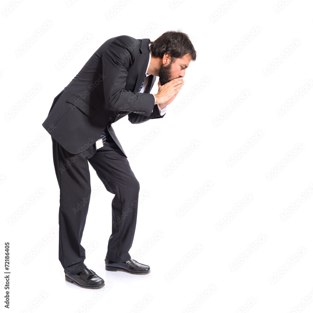 Businessman shouting down over isolated white background Businessman shouting down over isolated white background