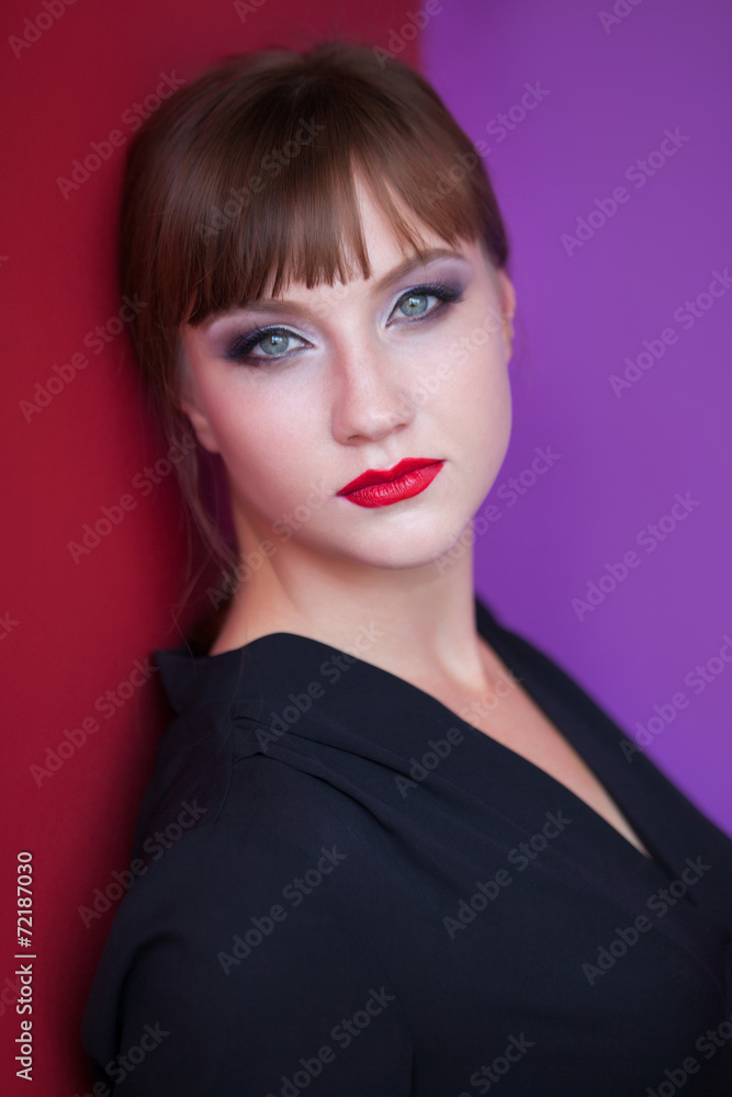 Portrait of bruneette girl on red and violet background Portrait of bruneette girl on red and violet background