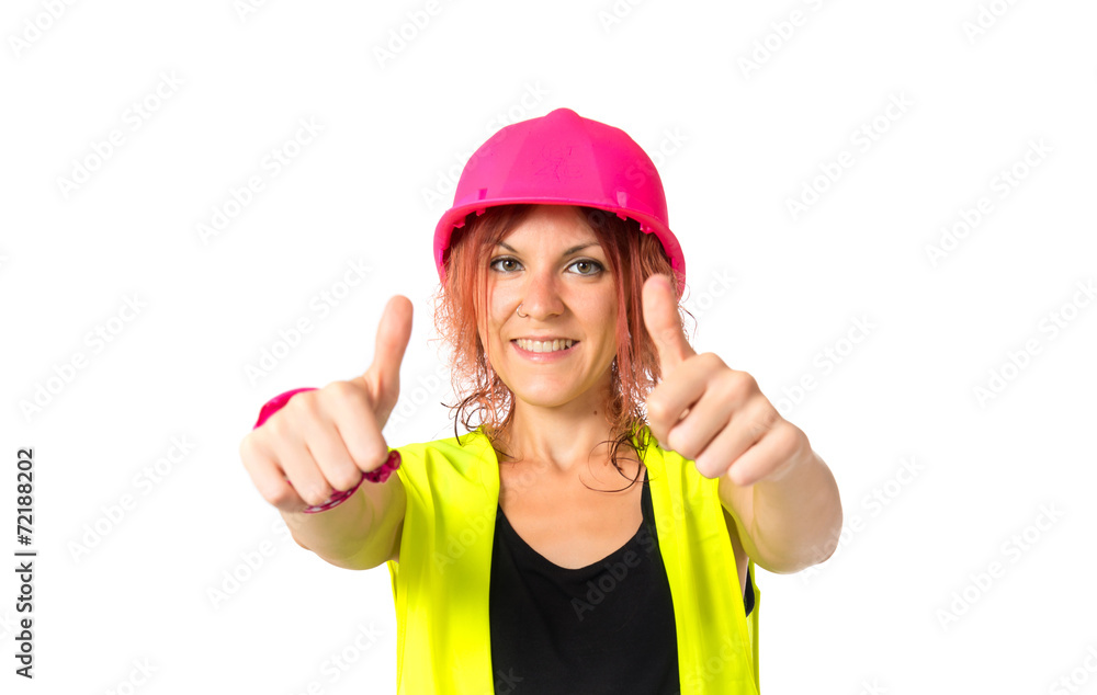 Worker woman making Ok sign over white background Worker woman making Ok sign over white background