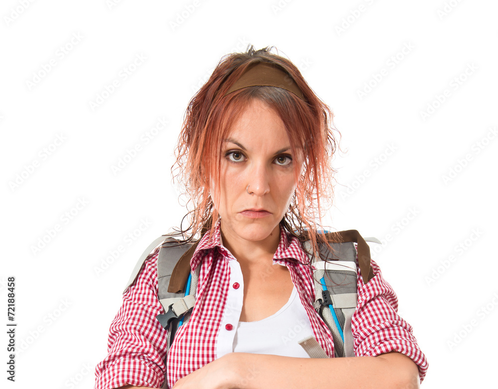 backpacker with her arms crossed over white background backpacker with her arms crossed over white background