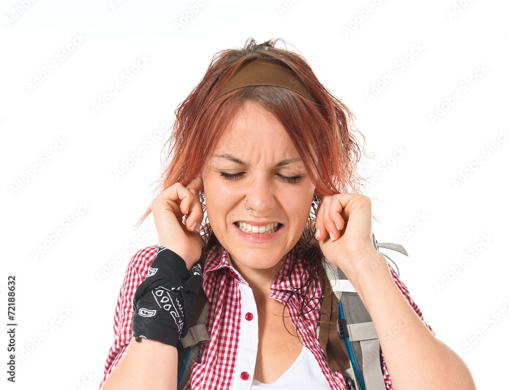 backpacker covering her ears over white background backpacker covering her ears over white background
