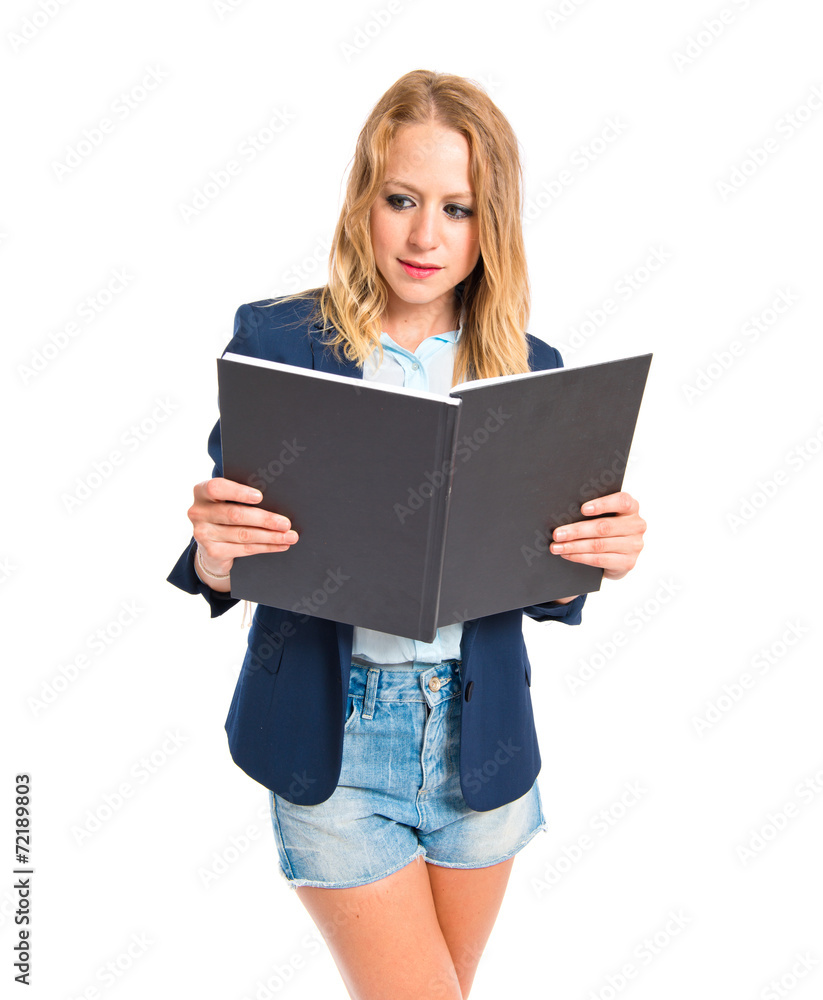 Girl reading a book over white background Girl reading a book over white background