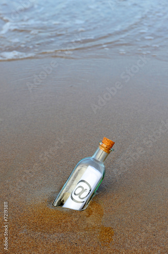 Glass bottle with digital message, @ photo