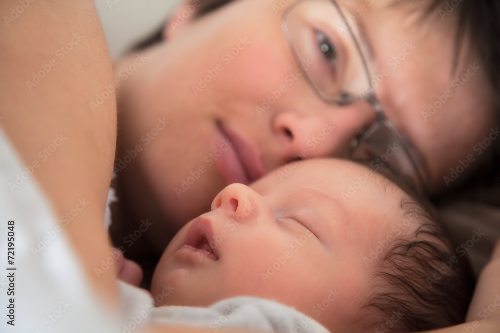 Mother and newborn baby asleep Mother and newborn baby asleep