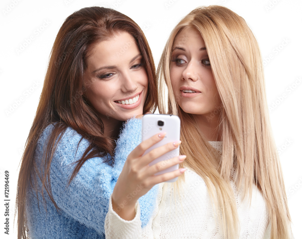 two beautiful girls making selfies at studio two beautiful girls making selfies at studio